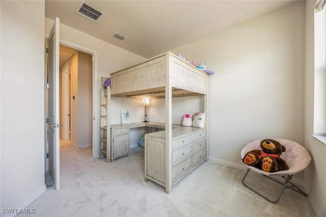 bedroom featuring baseboards, visible vents, and light carpet