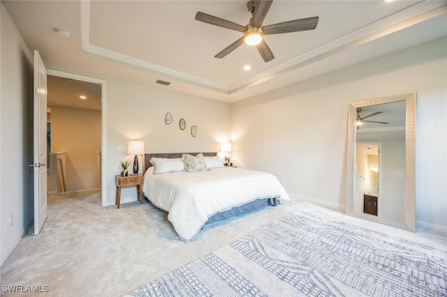 bedroom featuring visible vents, a tray ceiling, ornamental molding, carpet flooring, and recessed lighting