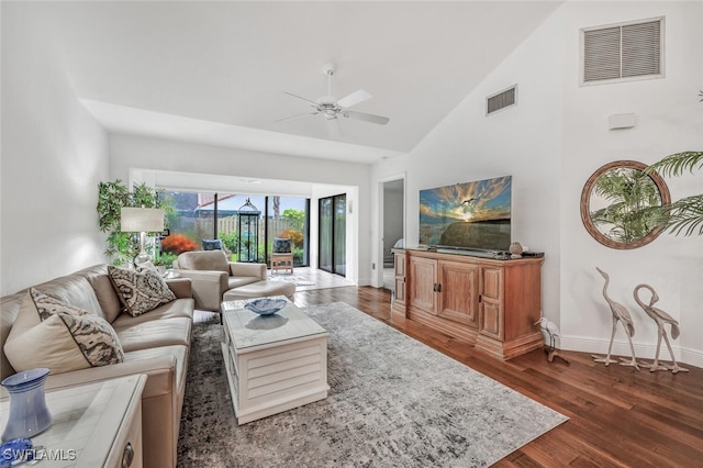 living area featuring visible vents, baseboards, ceiling fan, and wood finished floors