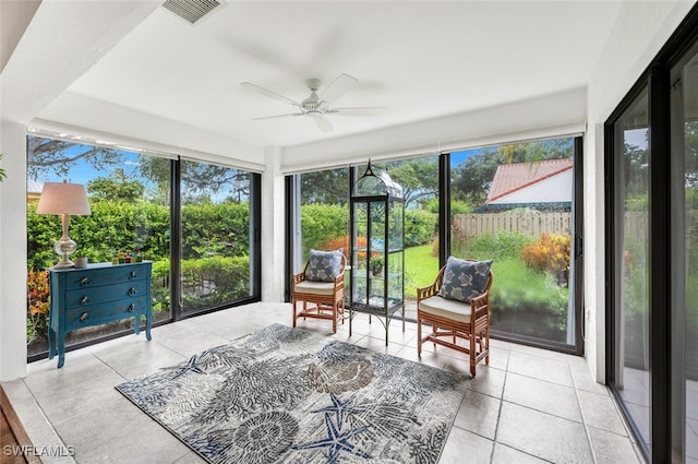 sunroom with visible vents and ceiling fan