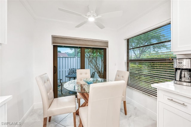 dining area with plenty of natural light, baseboards, and marble finish floor