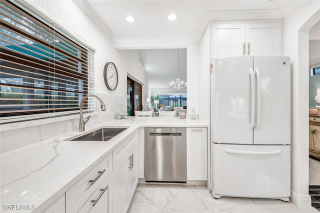 kitchen with ornamental molding, stainless steel dishwasher, freestanding refrigerator, marble finish floor, and a sink