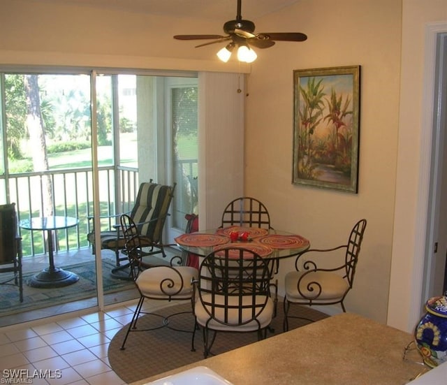 dining area featuring ceiling fan and tile patterned floors