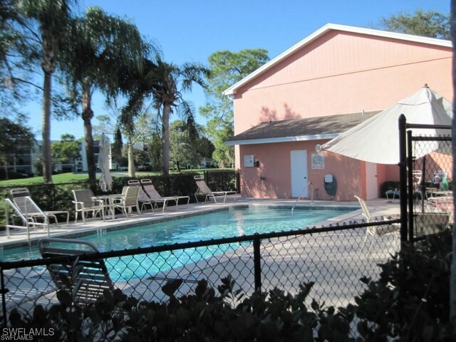 view of swimming pool with a patio area