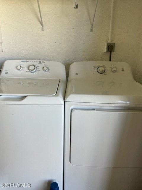 washroom featuring independent washer and dryer