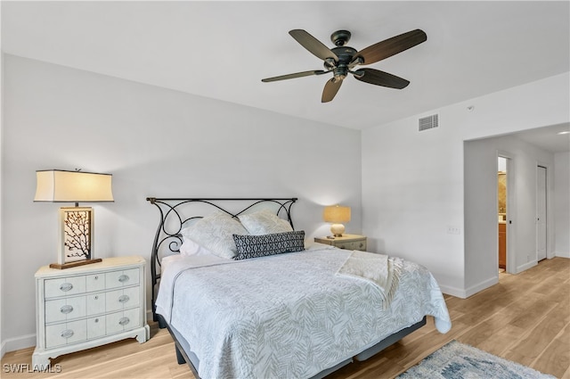 bedroom with wood-type flooring and ceiling fan