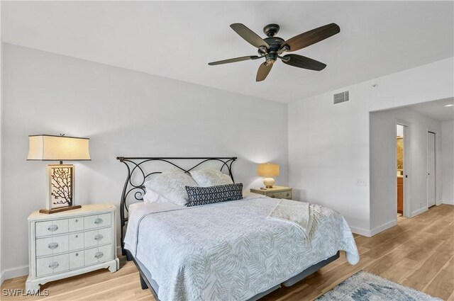 13256 Sherburne Cir Unit 2601, Bonita Springs, FL 34135 - bedroom with light wood-style flooring, baseboards, and ceiling fan