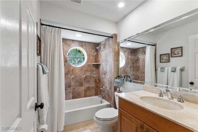 full bathroom featuring vanity, toilet, and shower / tub combo with curtain