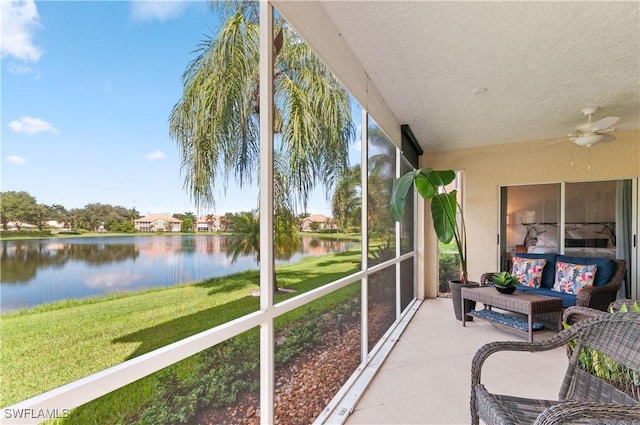 13256 Sherburne Cir Unit 2601, Bonita Springs, FL 34135 - sunroom / solarium featuring a water view, a ceiling fan, and an outdoor living space