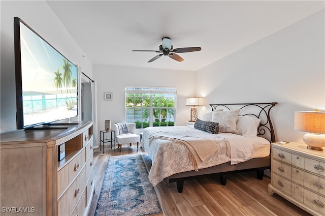 bedroom featuring ceiling fan and dark hardwood / wood-style floors