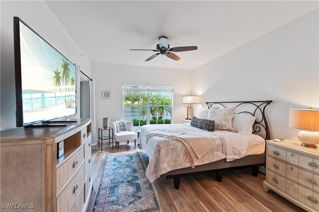 13256 Sherburne Cir Unit 2601, Bonita Springs, FL 34135 - bedroom featuring wood finished floors and ceiling fan