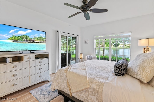 bedroom with access to exterior, ceiling fan, and light hardwood / wood-style floors