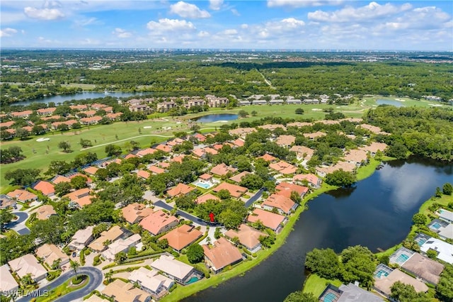 drone / aerial view featuring a water view, a residential view, and golf course view