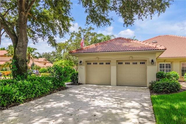 221 Napa Ridge Rd E, Naples, FL 34119 - garage with concrete driveway