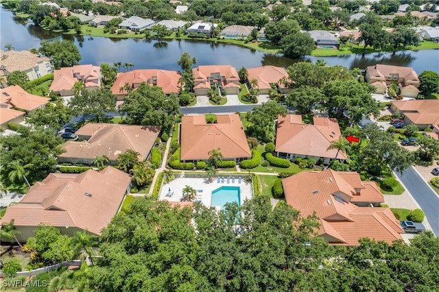 drone / aerial view featuring a residential view and a water view