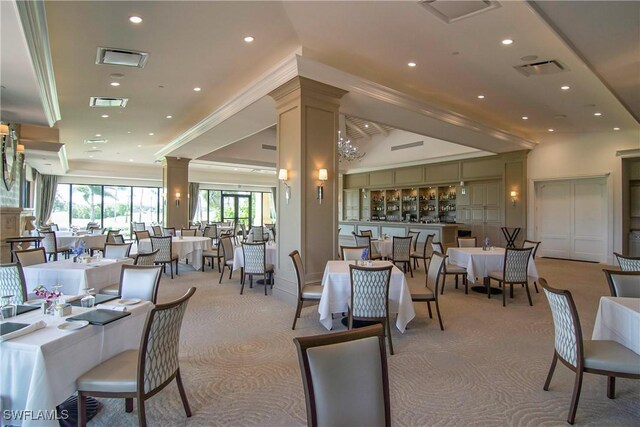 dining room featuring crown molding, recessed lighting, visible vents, and ornate columns