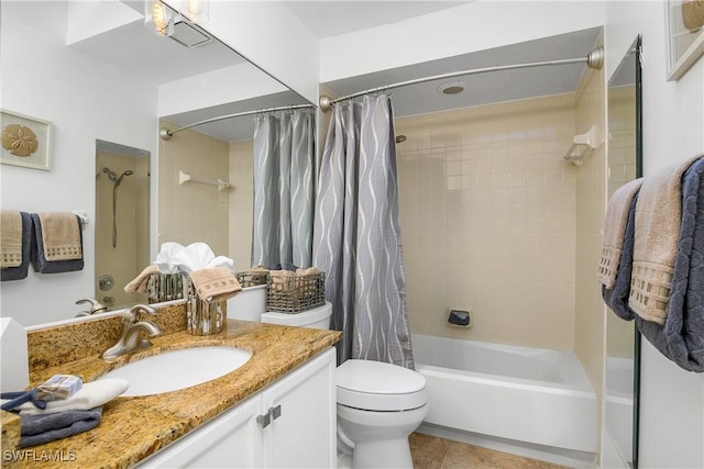 full bath featuring vanity, tile patterned flooring, shower / bath combo with shower curtain, and toilet