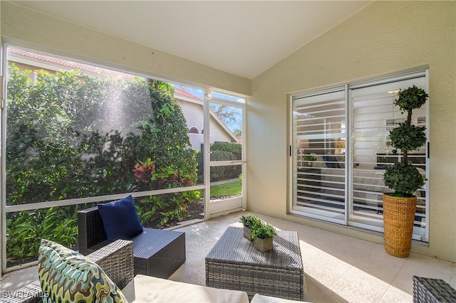 sunroom with vaulted ceiling