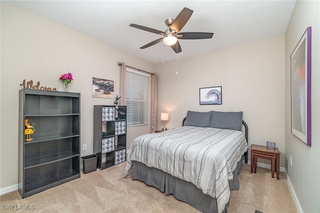 bedroom with ceiling fan and carpet flooring