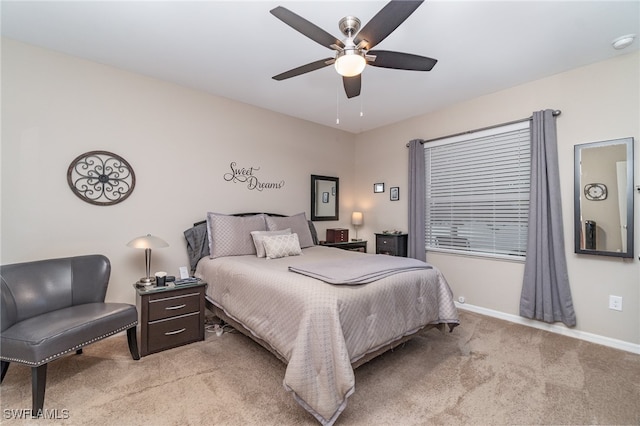 bedroom featuring ceiling fan and light colored carpet