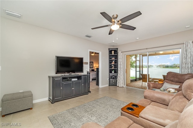 tiled living room with ceiling fan