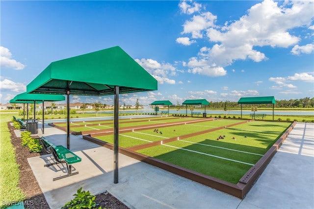 surrounding community featuring a water view