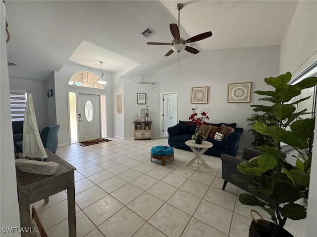 tiled living room featuring high vaulted ceiling and ceiling fan