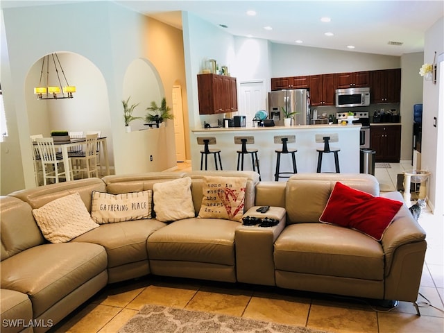 tiled living room with vaulted ceiling