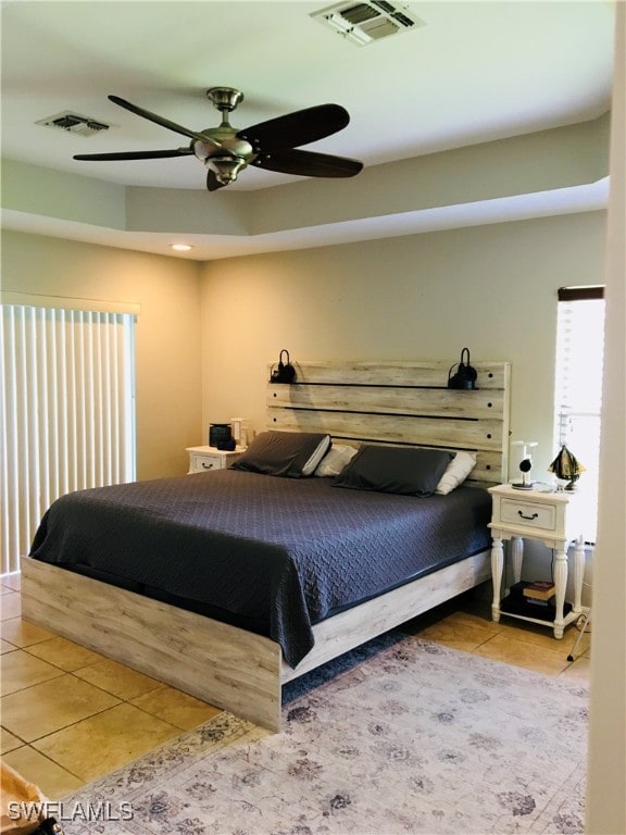 bedroom with light tile patterned flooring and ceiling fan