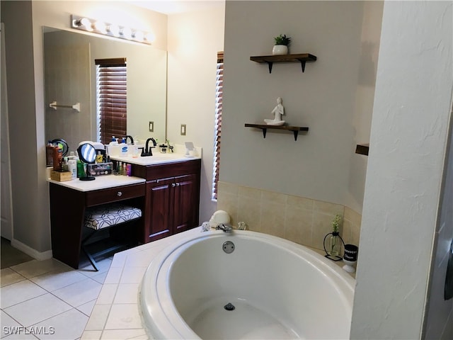 bathroom featuring vanity, tiled tub, and tile patterned floors