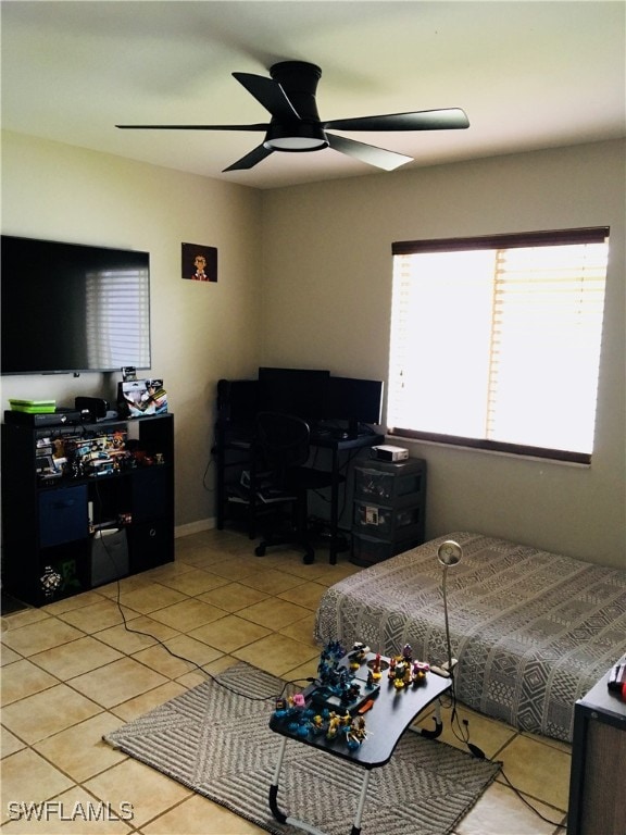 tiled bedroom with ceiling fan