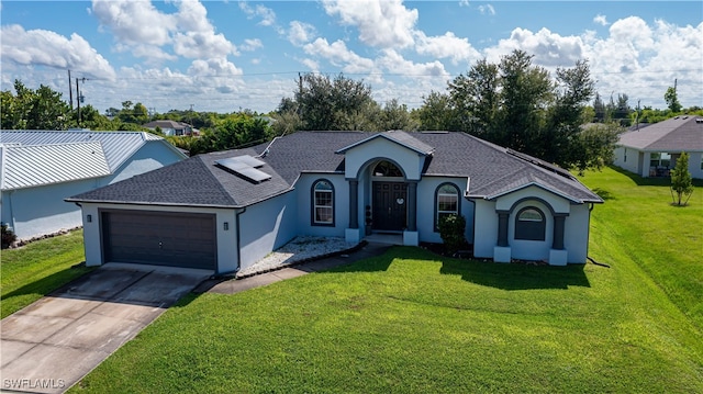 single story home featuring a front yard and a garage