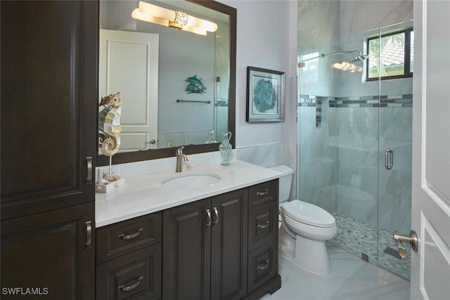 bathroom with toilet, a shower with door, and vanity