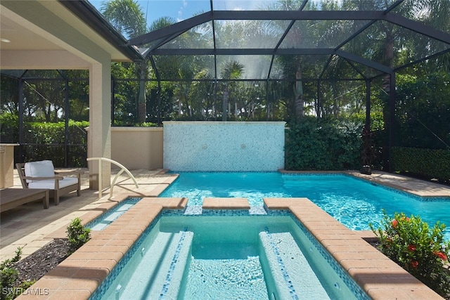 view of swimming pool featuring glass enclosure, a patio, and an in ground hot tub