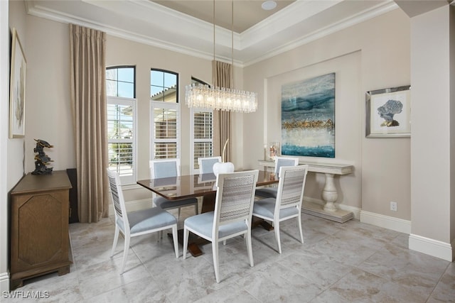 dining room featuring crown molding, a chandelier, and a tray ceiling