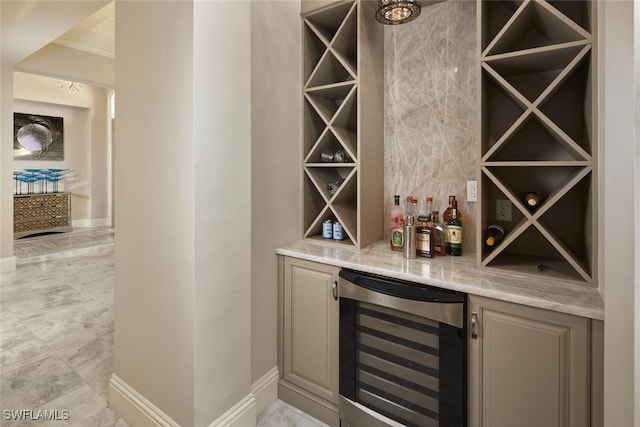 wine room with crown molding, wine cooler, and bar