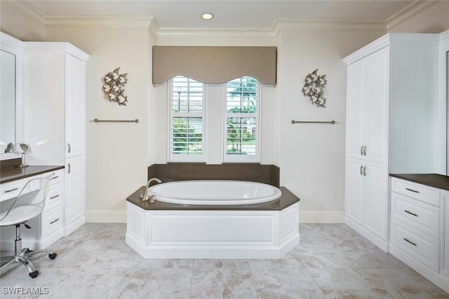 bathroom with vanity, tiled tub, and ornamental molding