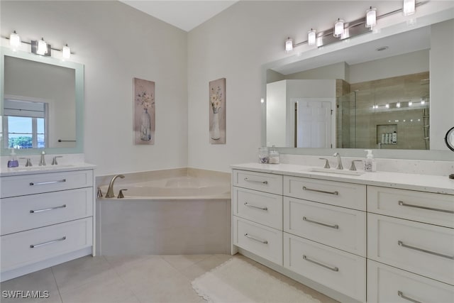 bathroom with vanity, tile patterned flooring, and shower with separate bathtub