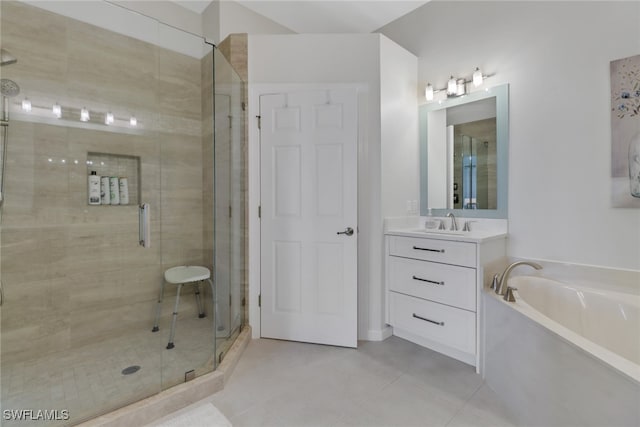 bathroom featuring tile patterned flooring, shower with separate bathtub, and vanity