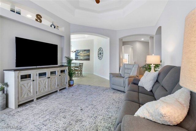 living room featuring ceiling fan and light tile patterned floors