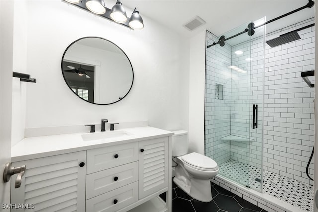 bathroom with tile patterned flooring, toilet, vanity, visible vents, and a stall shower