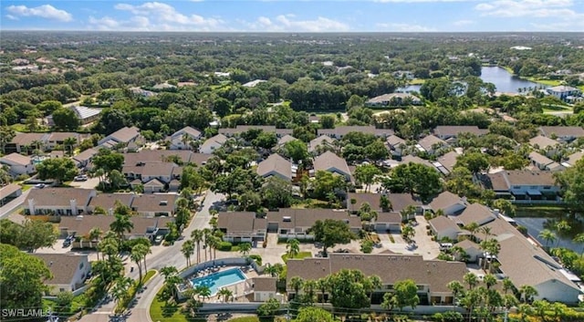 bird's eye view featuring a water view and a residential view