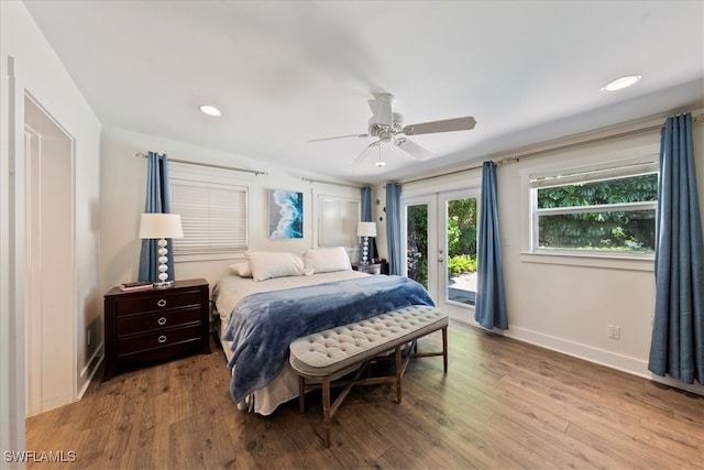 bedroom with ceiling fan, french doors, access to exterior, and wood-type flooring