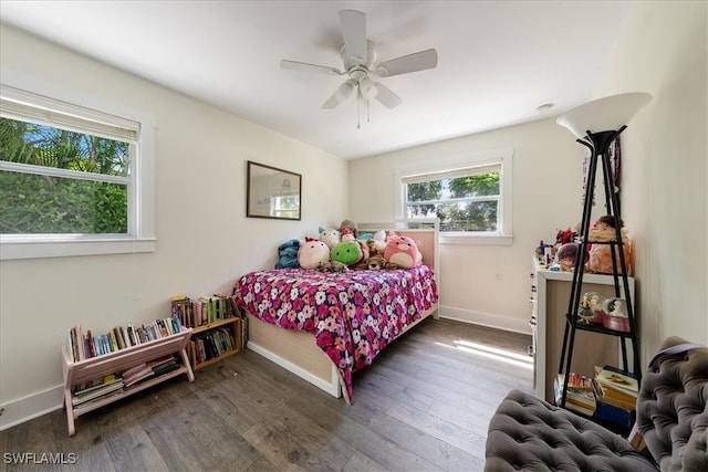 bedroom featuring dark hardwood / wood-style flooring and ceiling fan