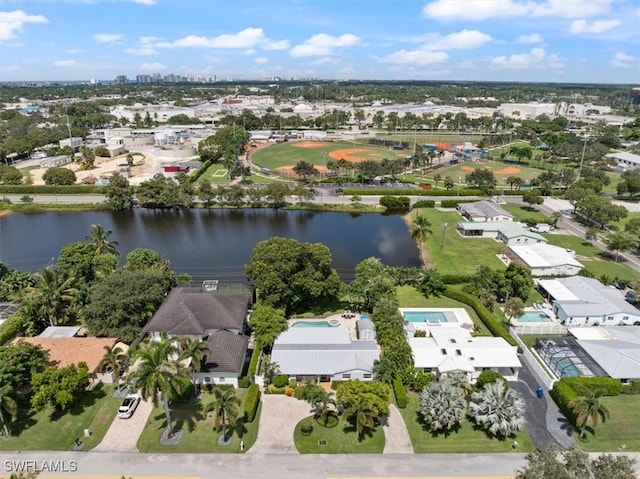 birds eye view of property with a water view