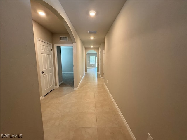 hallway featuring light tile patterned floors