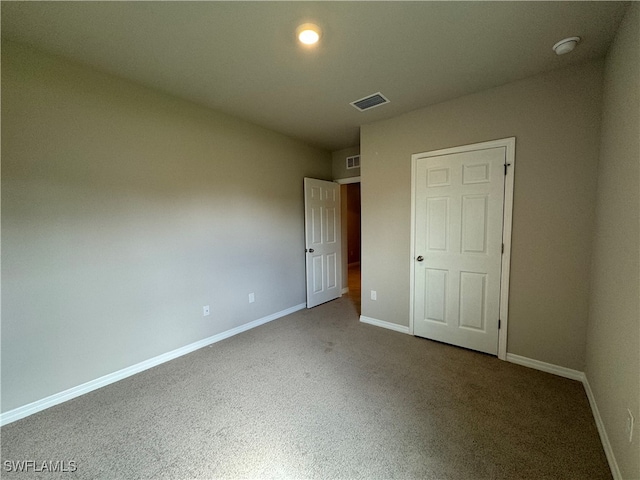 unfurnished bedroom featuring carpet