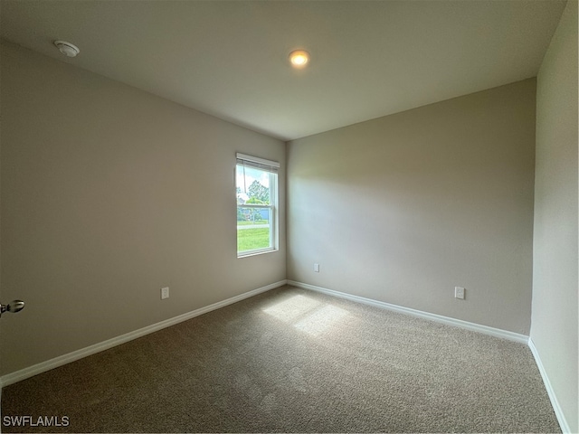 empty room with carpet flooring