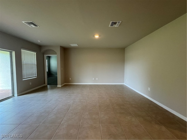 unfurnished room featuring light tile patterned floors