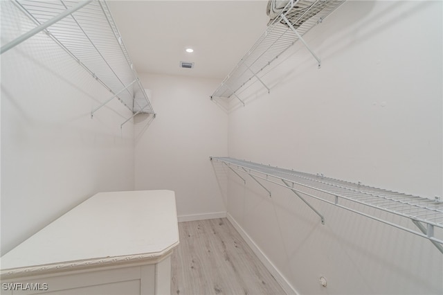 walk in closet featuring light hardwood / wood-style floors